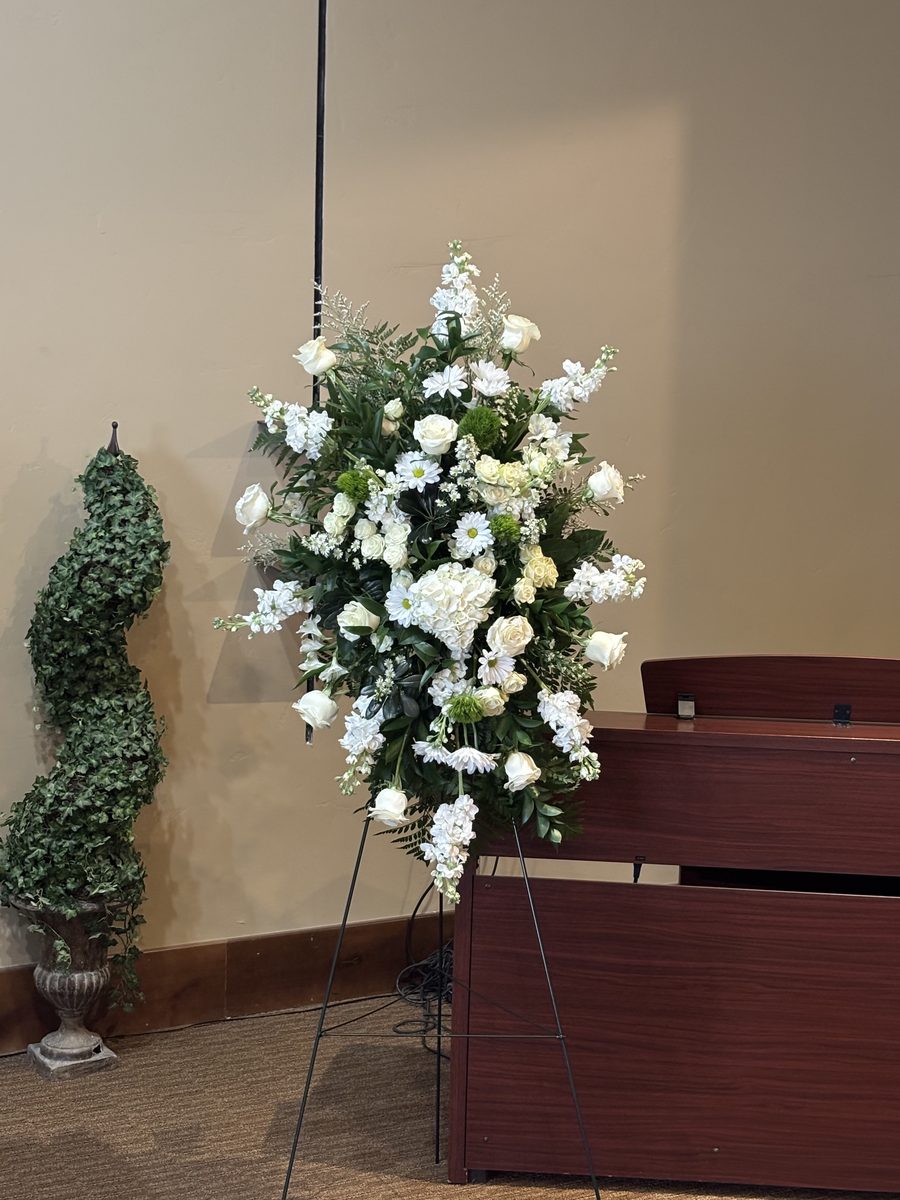 Standing Spray - All-white standing spray with roses, daisies, and lush greenery